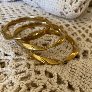 Twist gold tone bangle bracelets